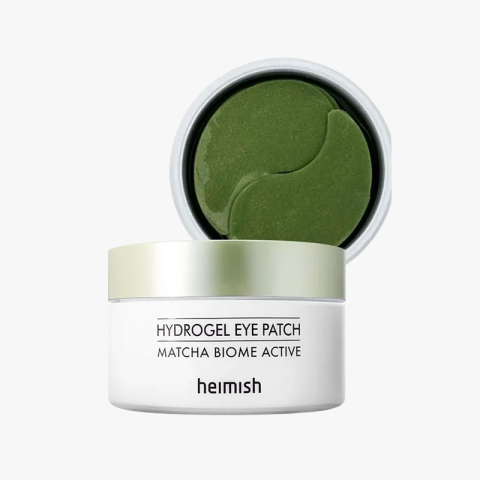 Heimish hydrogel eye patch jar, matcha green onyx-shaped patches visible inside the lid