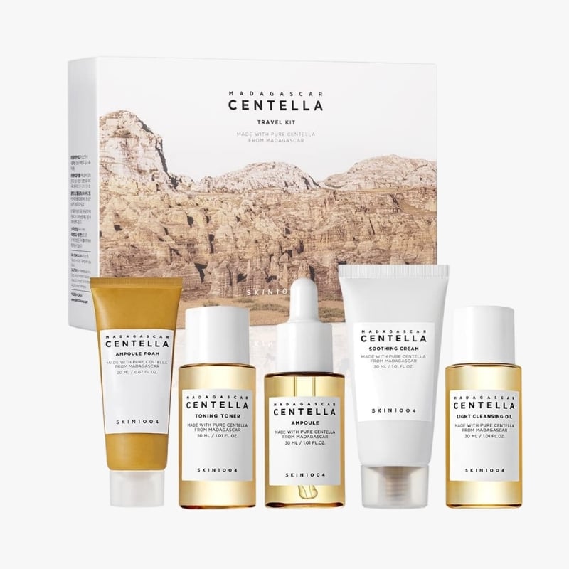 Madagascar Centella travel skincare kit with six products arranged in front of a white box on a clean background