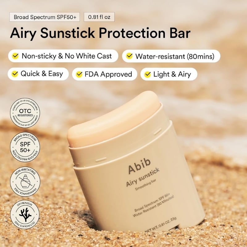 Airy Sunstick Protection Bar on sand; SPF50+, water resistant, non-sticky and easy to use features listed above the product.