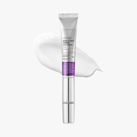 Silver tube of eye cream with white cream smeared behind it, skincare product on a white background
