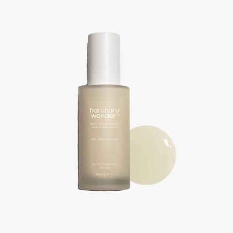Frosted glass bottle of Haruharu Wonder Black Rice Hyaluronic Anti-Wrinkle Serum with a white pump-top cap