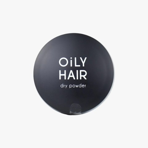 Round black compact with white text reading 'OILY HAIR dry powder' on a white background, product label visible.