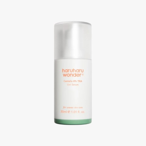 White cylindrical skincare serum bottle with a metallic cap; reads 'haruharu wonder' and 'Centella 4% TXA Gel Serum' (30 ml) on a white to pale gradient body with a green base.