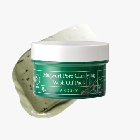 Green jar of Mugwort Pore Clarifying Wash Off Pack with white lid and cream-green paste splashed behind it, brand AXIS-Y visible on label, product close-up