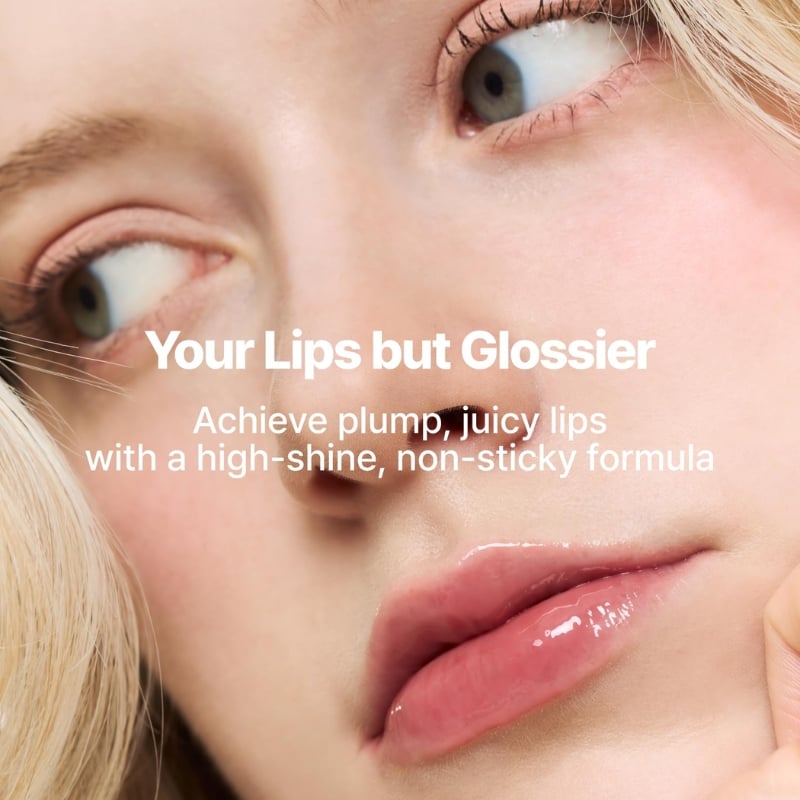 Close-up of a woman's glossy pink lips with overlay text 'Your Lips but Glossier'—advertising a high-shine, non-sticky lip formula.