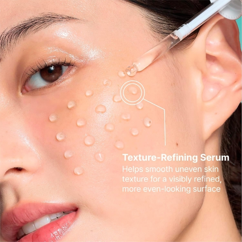 Close-up of a woman's cheek with serum droplets applied from a dropper, demonstrating texture-smoothing treatment; overlay reads 'Texture-Refining Serum' and benefits.