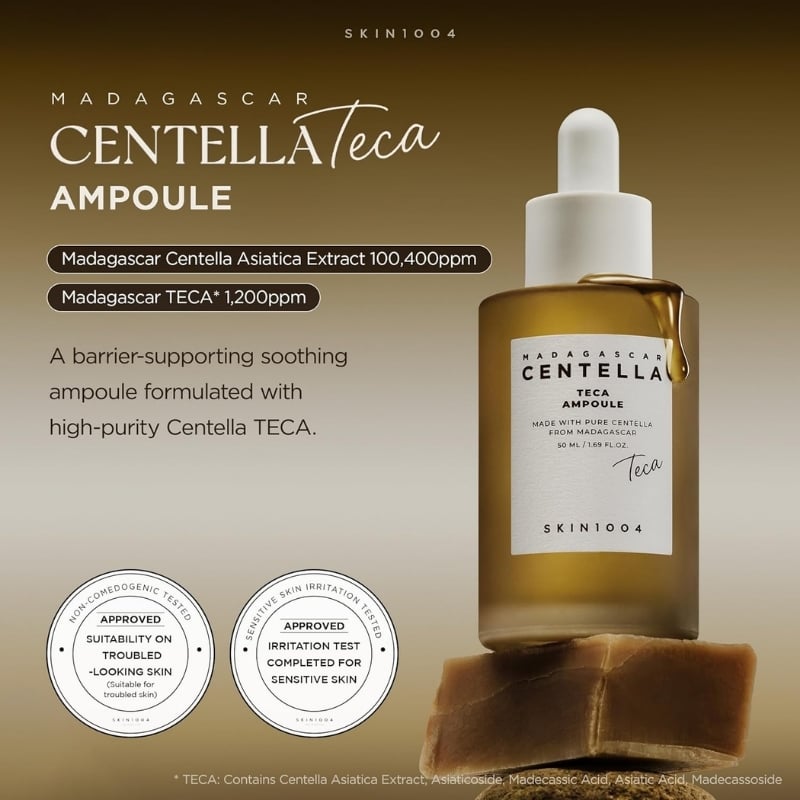 Dropper bottle of Madagascar Centella TECA Ampoule on a beige gradient, with labels noting Centella extract 100,400 ppm and TECA 1,200 ppm and two round approval seals.