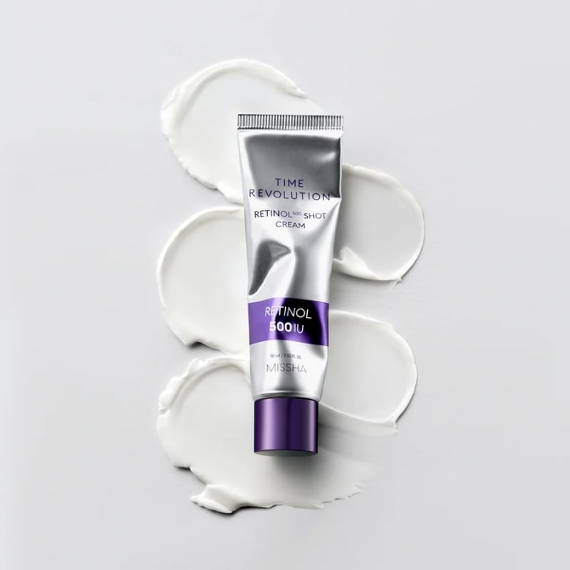 Missha Time Revolution Retinol 500IU Cream tube on a white background with cream swirls.",