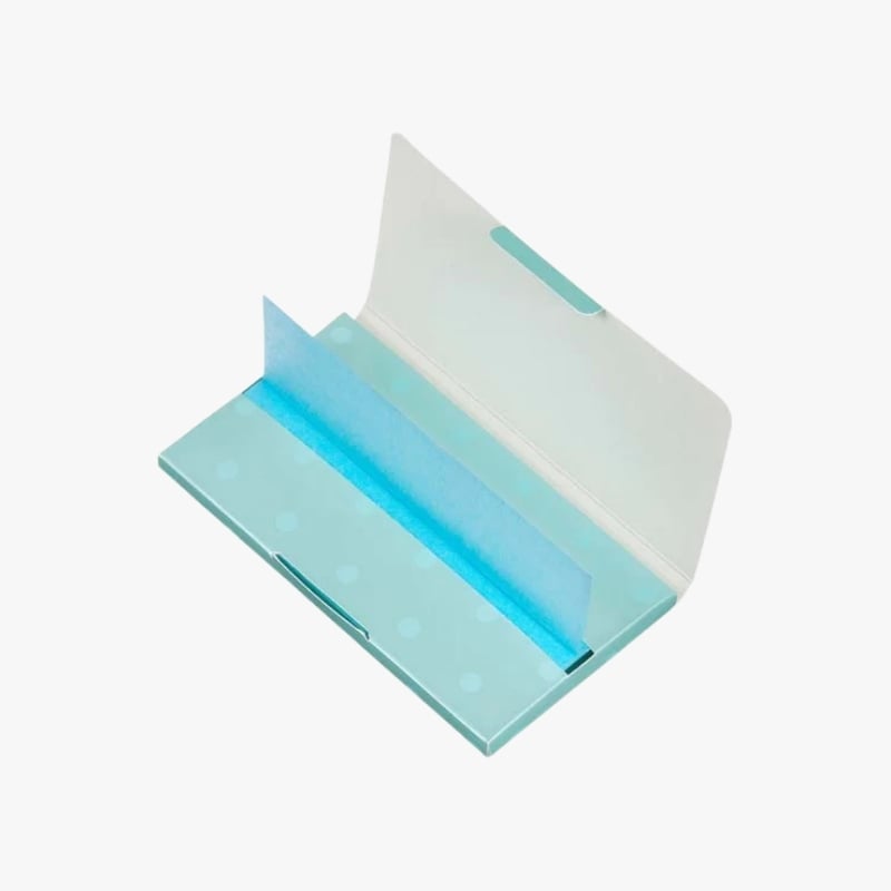 Mint-colored card organizer or file with a blue divider, shown open for organizing cards or papers