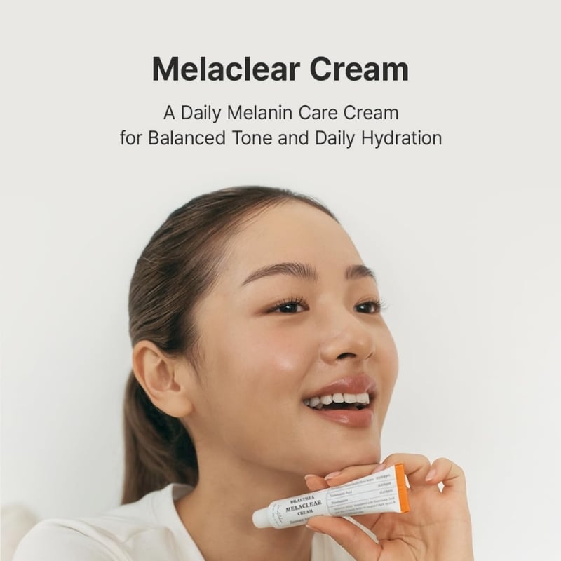 Smiling woman holding a tube of Melaclear Cream in front of a light backdrop; product name shown at top: Melaclear Cream for melanin care and hydration (informative image)