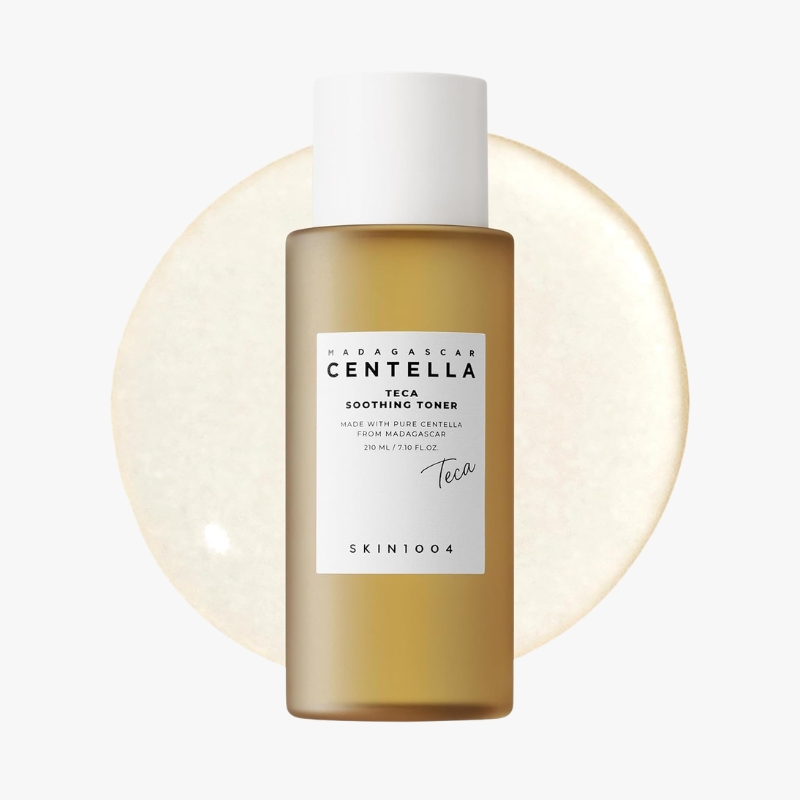 Brown glass bottle of Centella Teca Soothing Toner with a white label, centered in front of a pale beige circular backdrop.