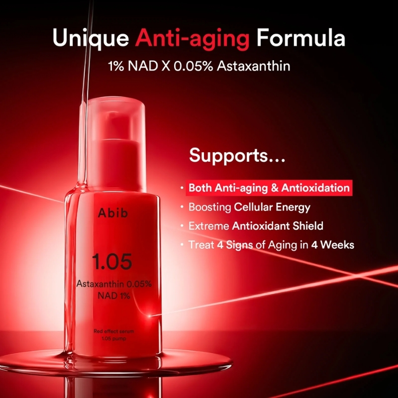 Red serum bottle labeled Abib 1.05 Astaxanthin NAD 1%, displayed on a reflective surface with bold 'Unique Anti-aging Formula' text in the background.