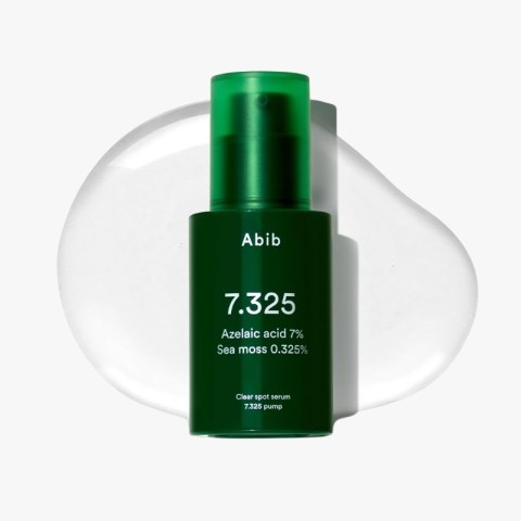Green bottle with 'Abib 7.325' serum; azelaic acid 7%, sea moss 0.325%, clear spot serum in pump bottle on white background