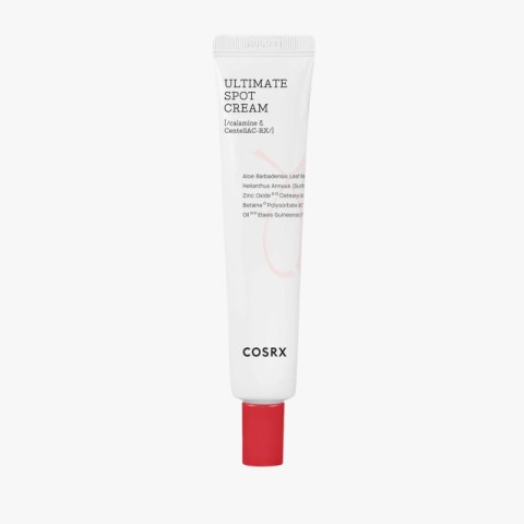 White COSRX Ultimate Spot Cream tube with a red screw-cap at the bottom on a light background.