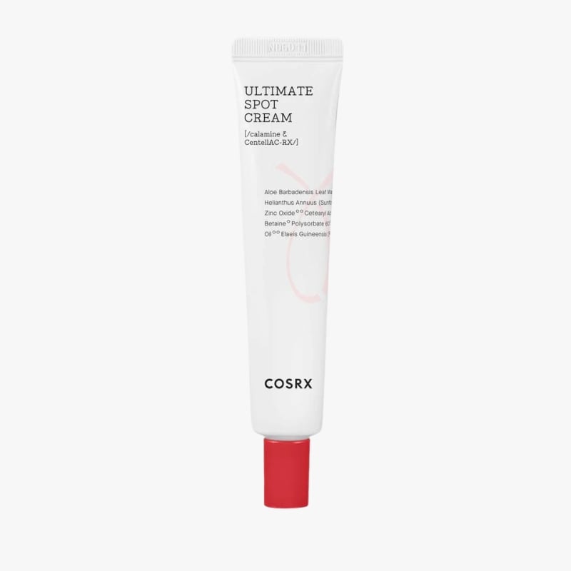 White COSRX Ultimate Spot Cream tube with a red screw-cap at the bottom on a light background.