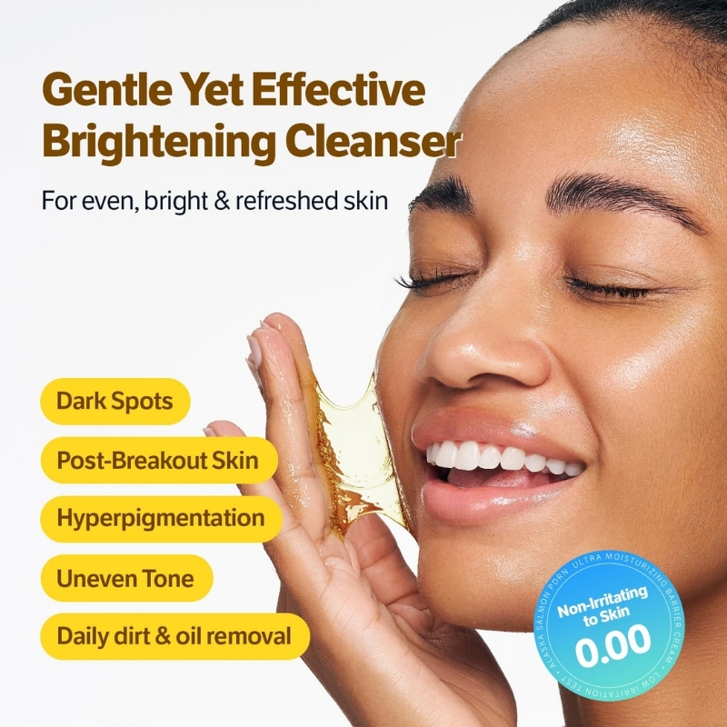 Advertisement for a Gentle Yet Effective Brightening Cleanser showing a smiling woman removing a gel peel; yellow rounded bullets read: Dark Spots, Post-Breakout Skin, Hyperpigmentation, Uneven Tone, Daily dirt & oil removal.